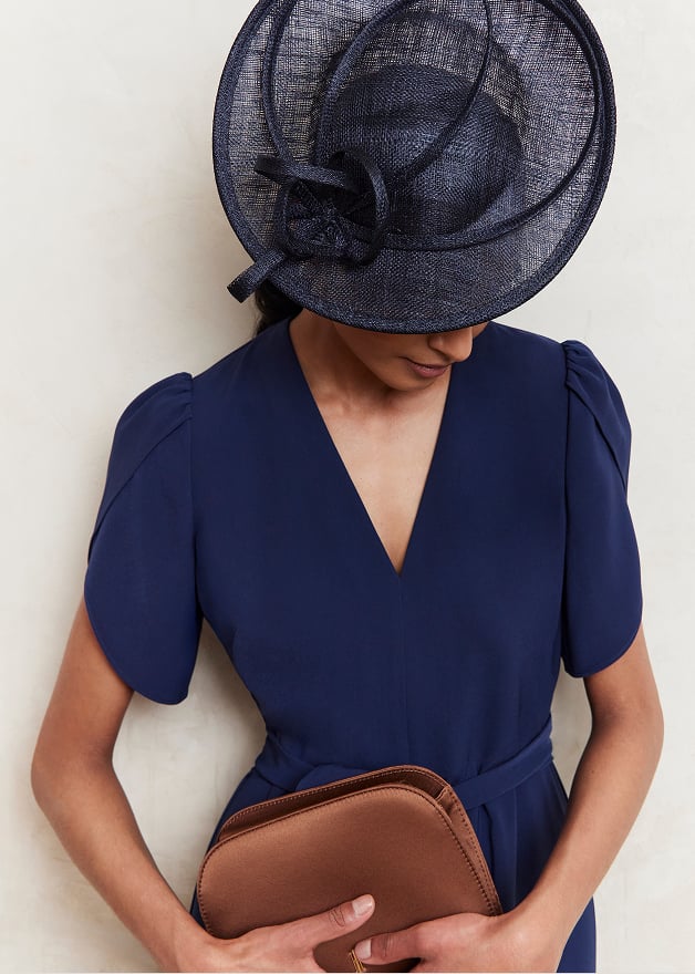 model wearing navy fascinators